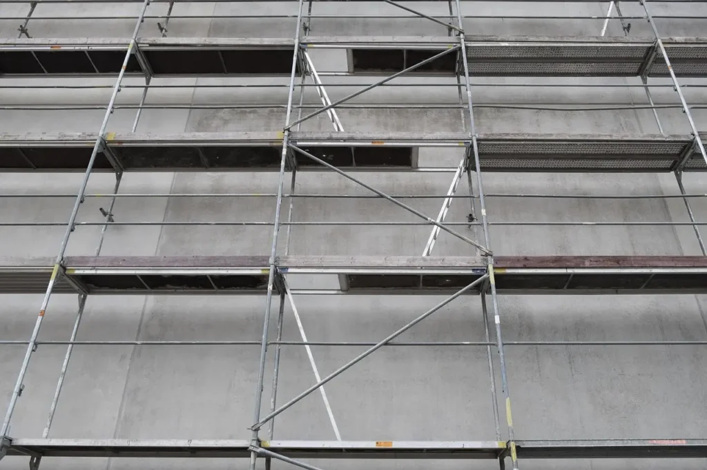 West Covina Scaffolding Rental scaffold platforms installed along a concrete building exterior